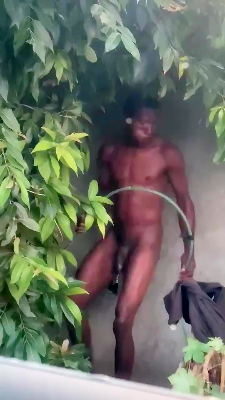 hot hung homeless bathing in abandoned lot